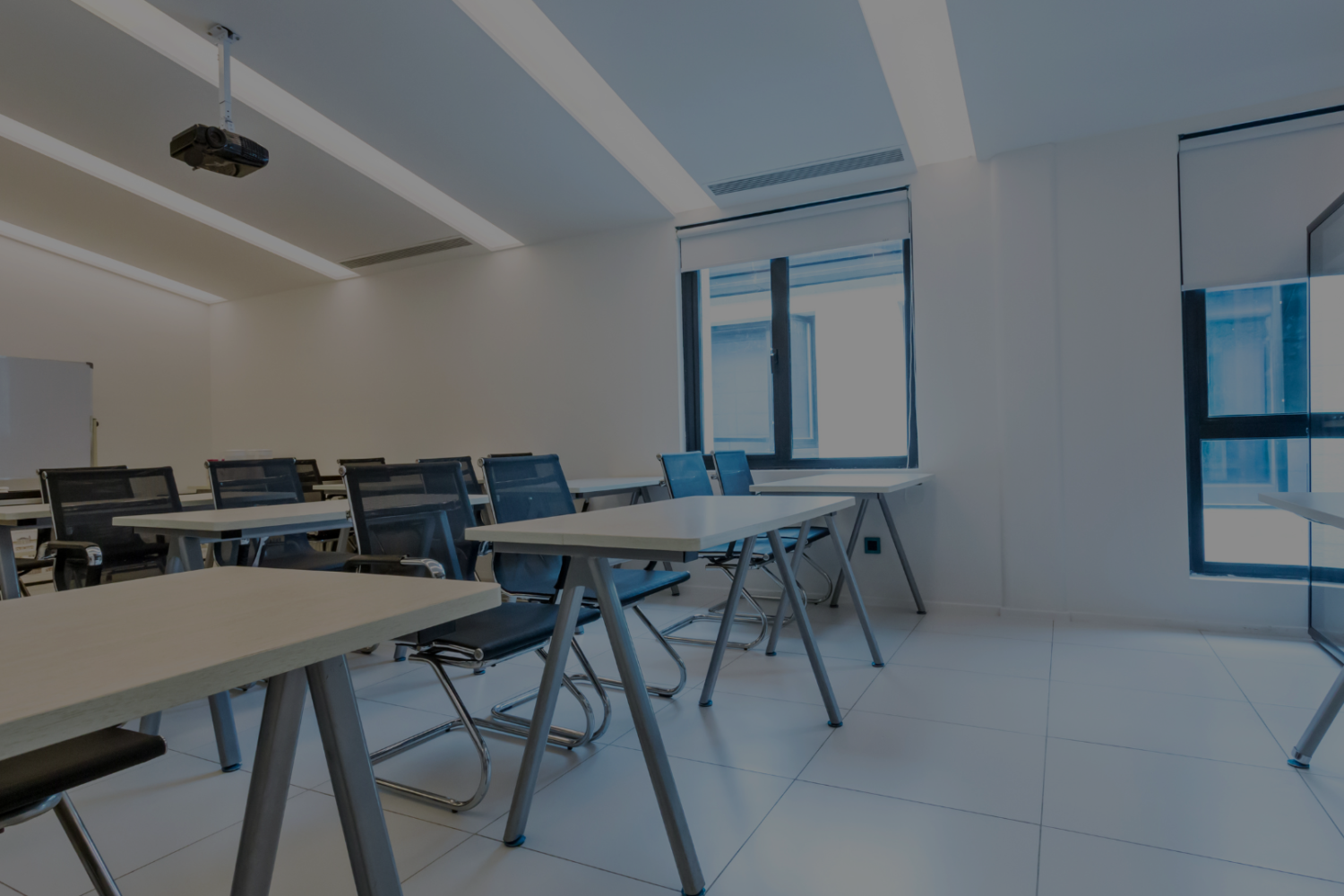 Photograph of a training room with all the seats empty. Image represents the need to identify training gaps in a business.