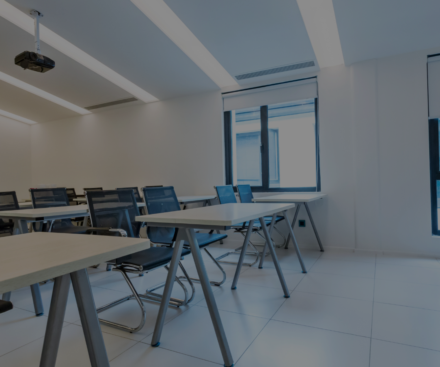 Photograph of a training room with all the seats empty. Image represents the need to identify training gaps in a business.